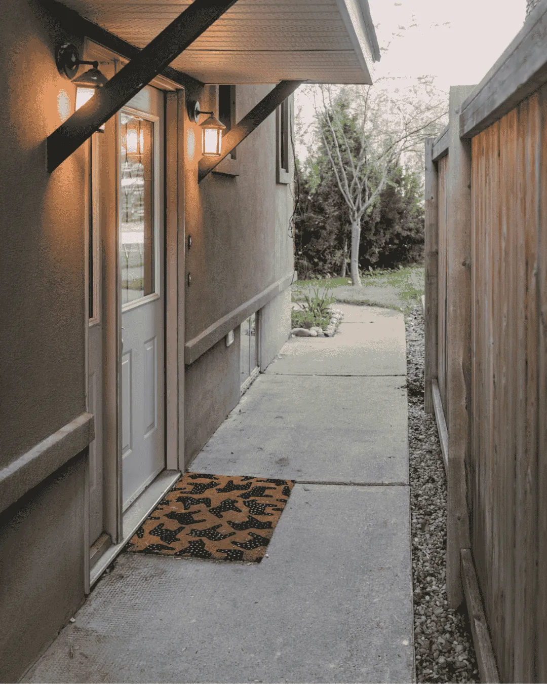 A side entrance walkway cleared of snow by Green Wolf in Saskatoon